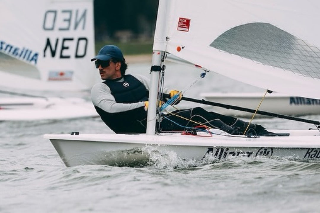 Francisco Guaragna sailing ILCA7 dinghy with BbTalkin coach communication system