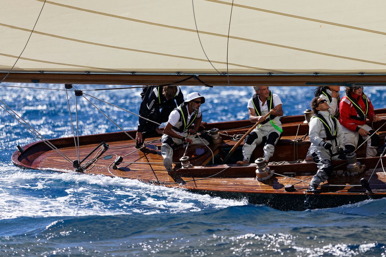 Yacht crew using BbTalkin waterproof intercoms during sail handling